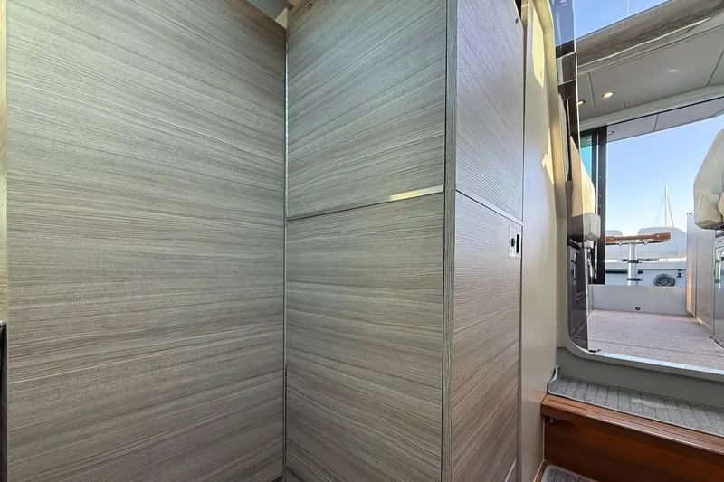 Slide: The Image of Interior view of 2024 Saxdor 320 GTC yacht, featuring modern wood paneling and sleek design. - 42