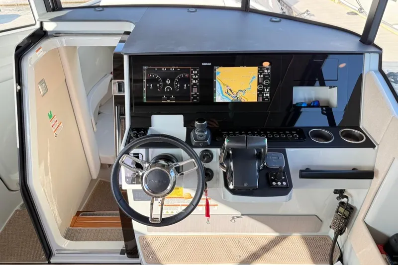 Slide: The Image of 2024 Saxdor 320 GTC helm with modern navigation display and controls. - 28