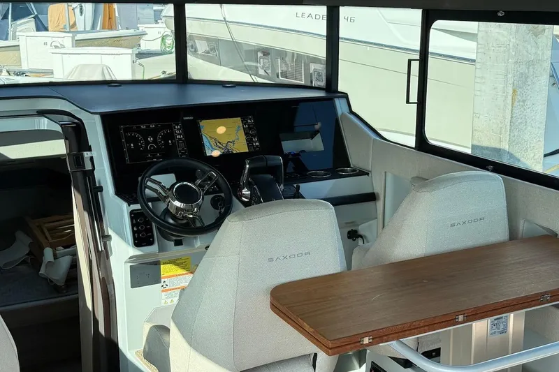 Slide: The Image of 2024 Saxdor 320 GTC helm with modern navigation system and comfortable seating. - 25