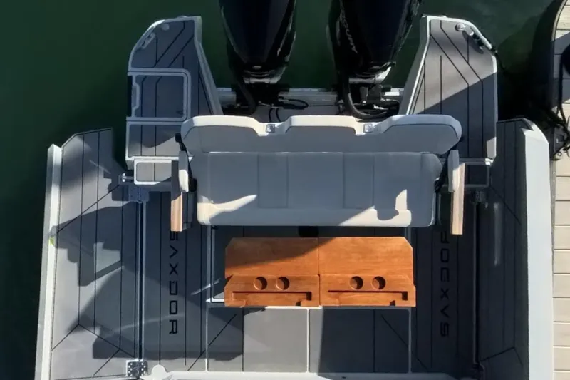 Slide: The Image of 2024 Saxdor 320 GTC boat deck with seating and wooden table, viewed from above. - 37