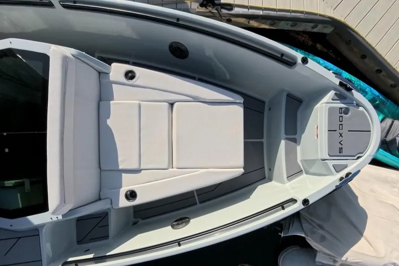 Slide: The Image of 2024 Saxdor 320 GTC boat deck with cushioned seating and sleek design. - 51