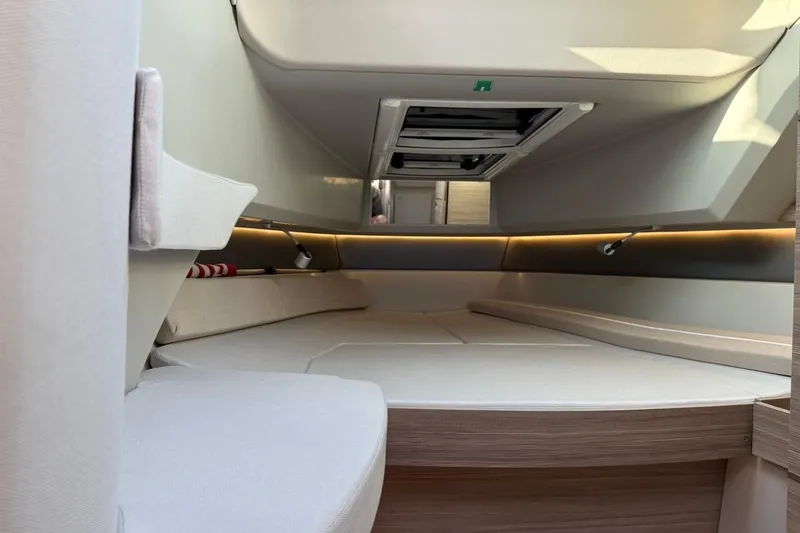 Slide: The Image of Interior cabin of 2024 Saxdor 320 GTC boat, featuring modern design and ambient lighting. - 35