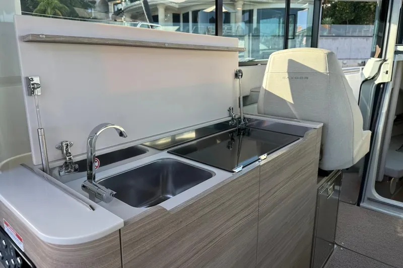 Slide: The Image of 2024 Saxdor 320 GTC interior with modern kitchenette and sleek design. - 31
