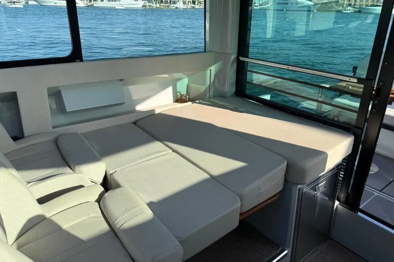 Slide: The Image of Interior of 2024 Saxdor 320 GTC yacht with comfortable seating and waterfront view. - 23