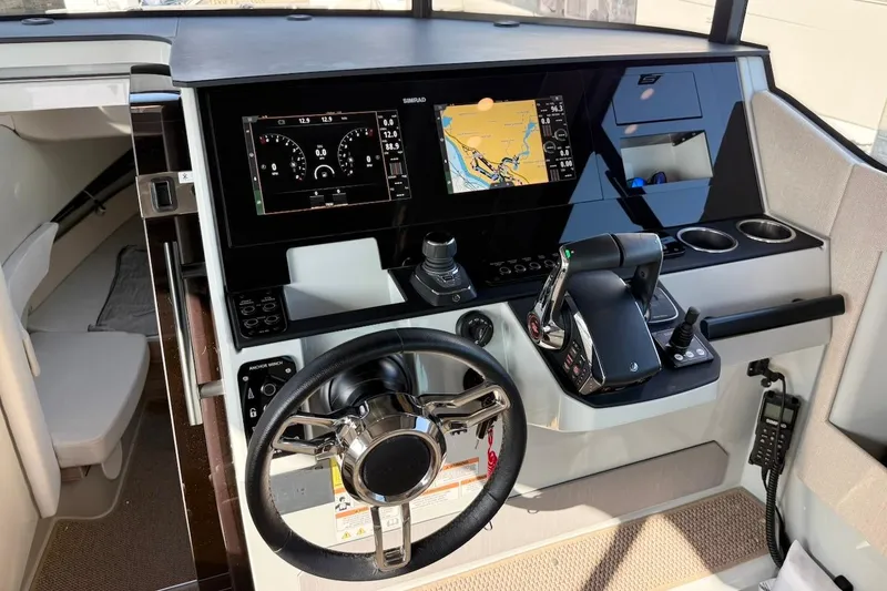 Slide: The Image of 2024 Saxdor 320 GTC helm with advanced navigation displays and controls. - 26