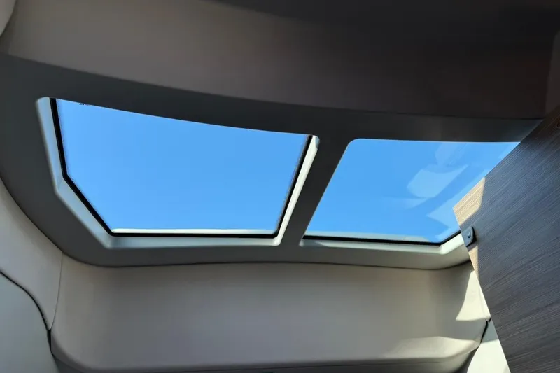 Slide: The Image of 2024 Saxdor 320 GTC interior skylight view with clear blue sky. - 39