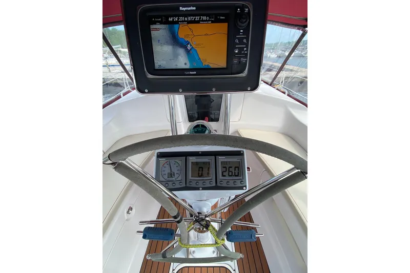 Slide: The Image of Cockpit of 2005 Hunter 38 sailboat with navigation equipment and steering wheel. - 6