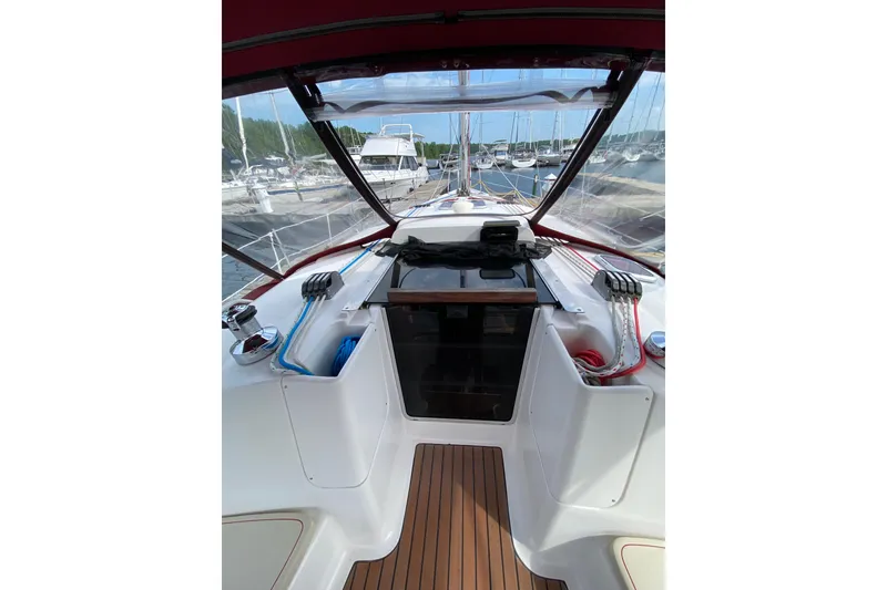Slide: The Image of Cockpit view of a 2005 Hunter 38 sailboat docked at a marina. - 8