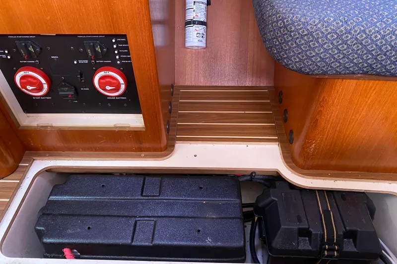 Slide: The Image of Electrical panel and battery compartment in a 2005 Hunter 38 sailboat interior. - 29