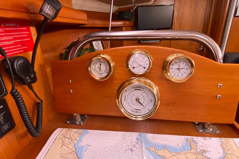 Slide: The Image of Nautical instruments on a 2005 Hunter 38 sailboat with a navigation map. - 27