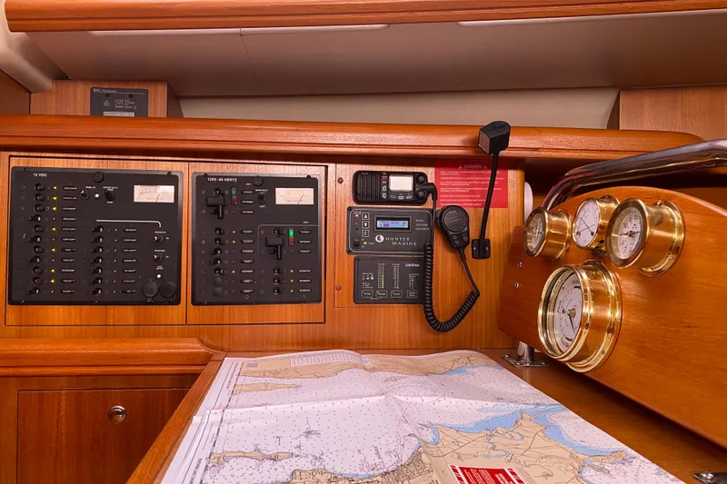 Slide: The Image of Control panel of a 2005 Hunter 38 sailboat with navigation instruments and map. - 25