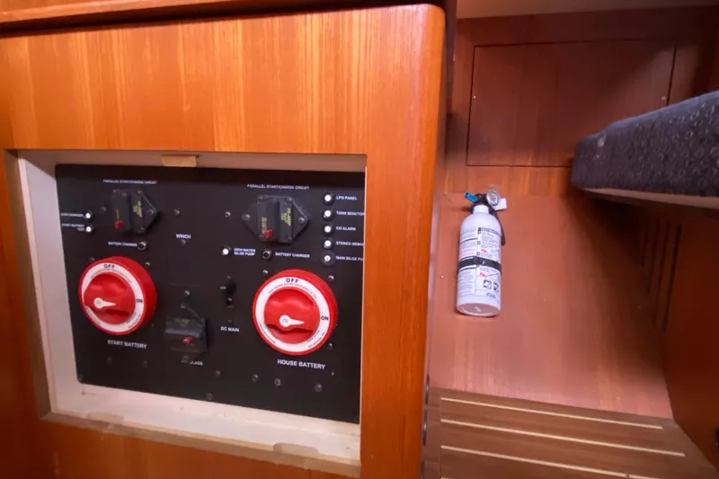 Slide: The Image of Electrical panel and fire extinguisher in 2005 Hunter 38 sailboat interior. - 28