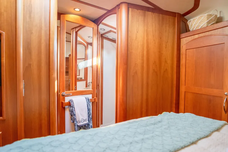 Slide: The Image of Interior of 2016 Sabre 48 Salon Express yacht with wooden cabinetry and cozy decor. - 37