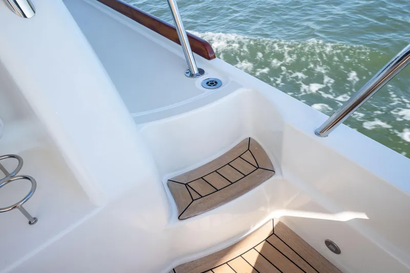 Slide: The Image of 2016 Sabre 48 Salon Express boat deck with teak steps and ocean view. - 11