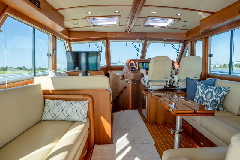Slide: The Image of Luxurious interior of 2016 Sabre 48 Salon Express yacht with plush seating and modern helm. - 20
