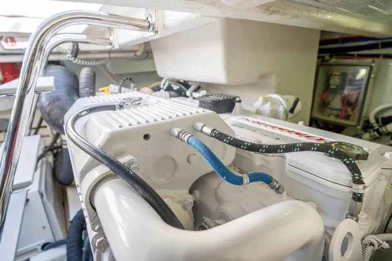 Slide: The Image of Engine room of 2016 Sabre 48 Salon Express yacht, showcasing detailed mechanical components. - 48