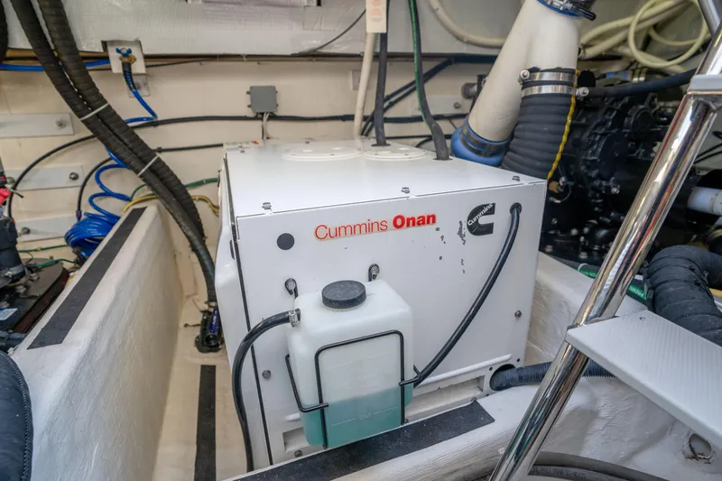 Slide: The Image of Engine room of 2016 Sabre 48 Salon Express with Cummins Onan generator. - 47