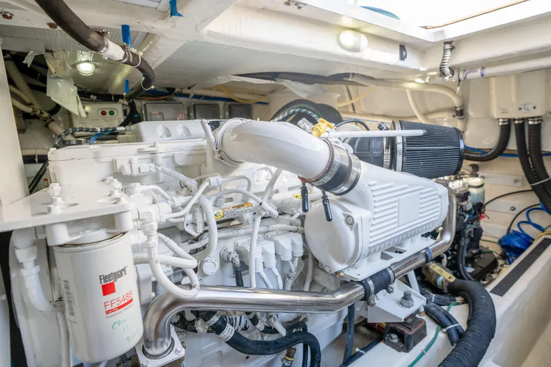 Slide: The Image of Engine room of 2016 Sabre 48 Salon Express yacht, showcasing detailed mechanical components. - 53