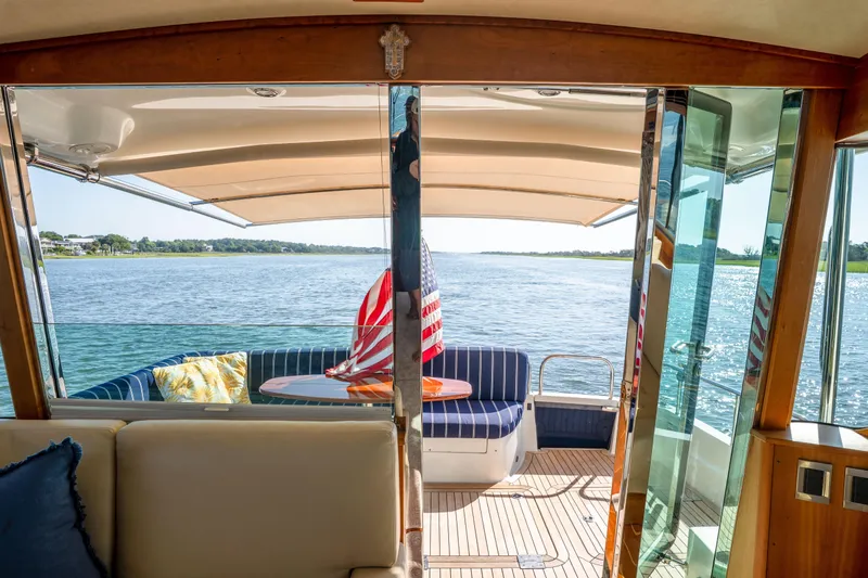 Slide: The Image of Interior view of 2016 Sabre 48 Salon Express yacht with scenic water backdrop. - 19