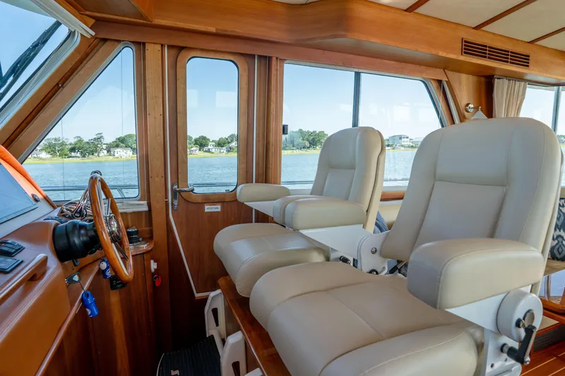 Slide: The Image of Interior of 2016 Sabre 48 Salon Express yacht with luxurious seating and scenic water view. - 22