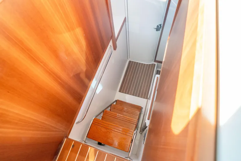 Slide: The Image of Staircase inside 2016 Sabre 48 Salon Express yacht with wooden finish. - 41