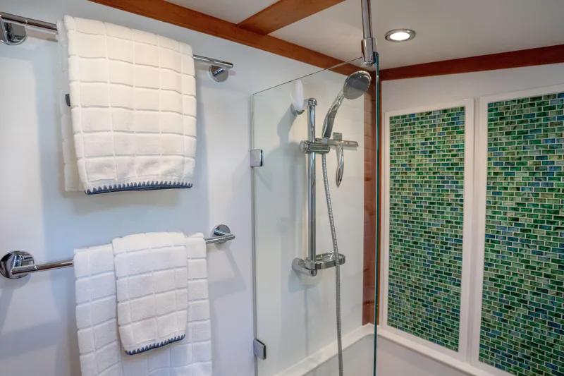 Slide: The Image of Luxurious bathroom in 2016 Sabre 48 Salon Express yacht with modern shower and elegant tile design. - 35