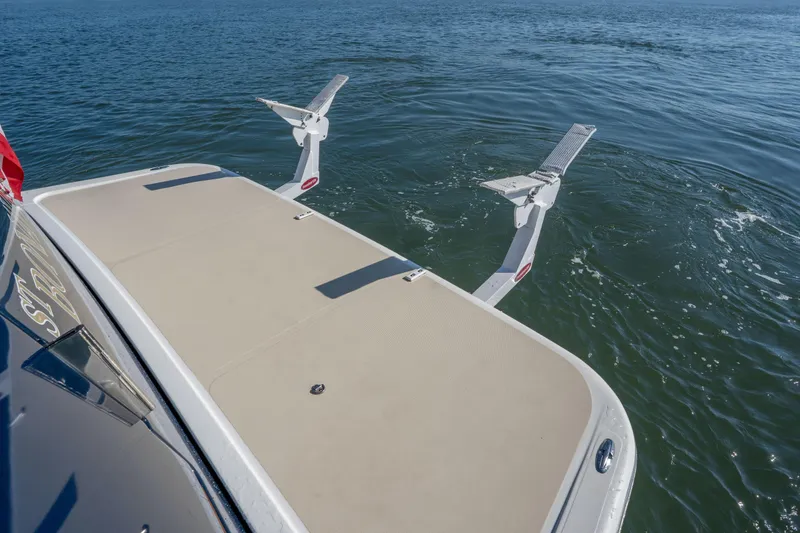 Slide: The Image of 2016 Sabre 48 Salon Express swim platform with retractable steps on calm water. - 6