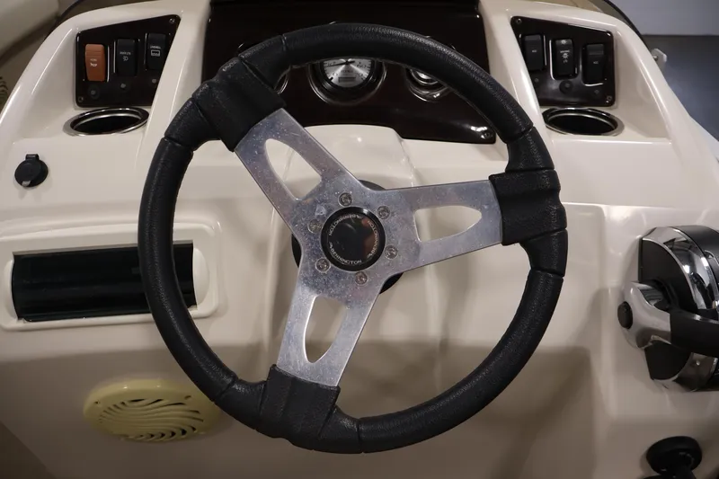 Slide: The Image of Steering wheel and dashboard of a 2013 Bennington 20 SLMX boat. - 18