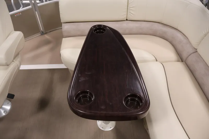 Slide: The Image of Luxurious interior of 2013 Bennington 20 SLMX pontoon boat with elegant seating and table. - 30