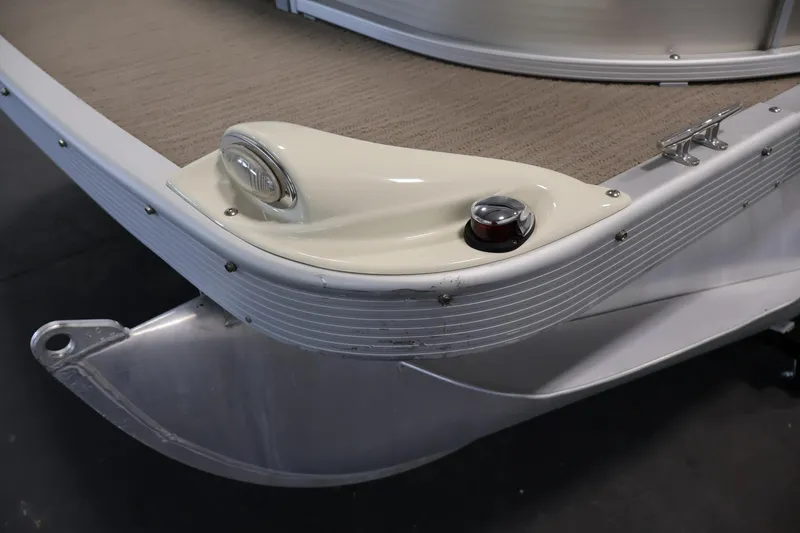 Slide: The Image of 2013 Bennington 20 SLMX pontoon boat corner detail with navigation light. - 38