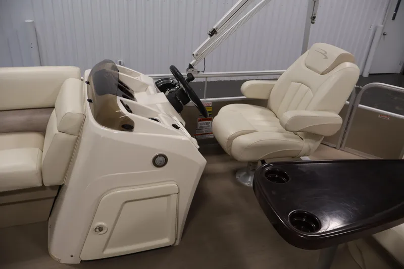 Slide: The Image of 2013 Bennington 20 SLMX boat interior with steering console and comfortable seating. - 15