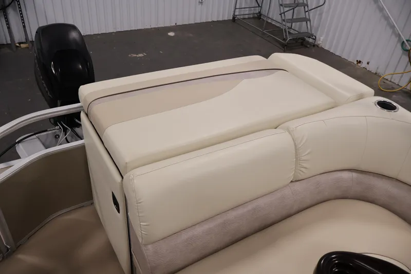 Slide: The Image of 2013 Bennington 20 SLMX boat interior with beige seating and outboard motor. - 31