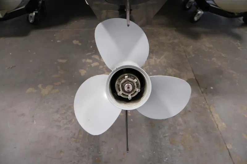 Slide: The Image of Propeller of a 2013 Bennington 20 SLMX boat on a concrete floor. - 36