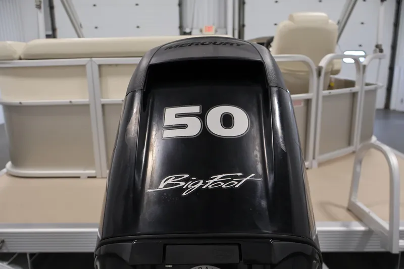 Slide: The Image of 2013 Bennington 20 SLMX with Mercury BigFoot 50 outboard motor in a showroom. - 35