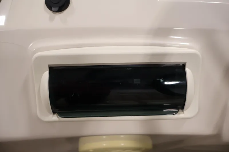Slide: The Image of Control panel of a 2013 Bennington 20 SLMX boat, featuring a sleek design. - 23