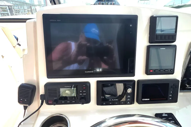 Slide: The Image of 2019 Cobia 280 Dual Console dashboard with Garmin navigation and audio controls. - 20
