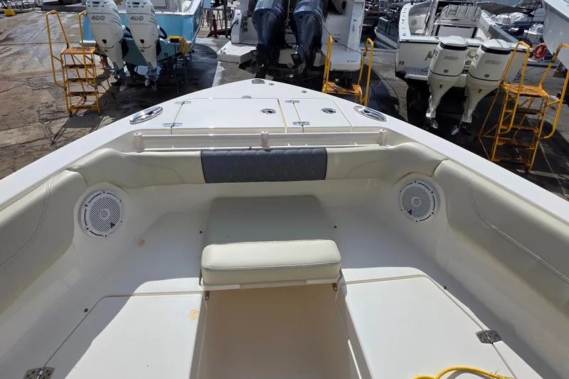 Slide: The Image of 2019 Cobia 280 Dual Console boat interior with seating and speakers. - 13