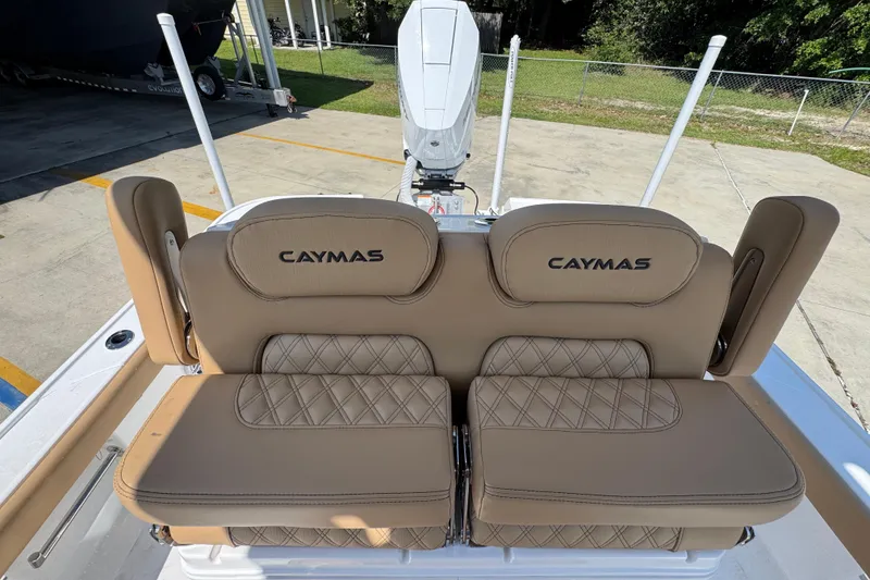 Slide: The Image of 2027 Caymas 26 HB boat seats with tan upholstery and diamond stitching detail. - 30
