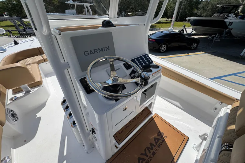 Slide: The Image of 2027 Caymas 26 HB boat helm with Garmin navigation system and Mercury steering wheel. - 33