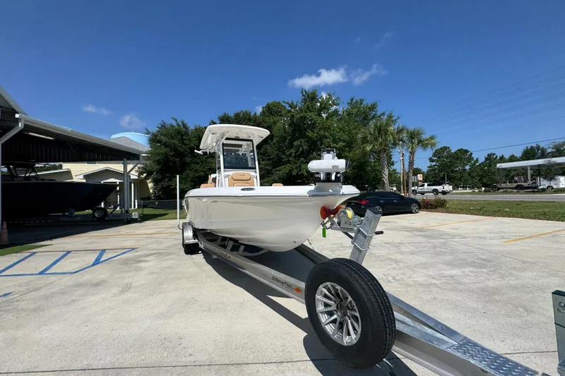 Slide: The Image of 2027 Caymas 26 HB boat on trailer in sunny outdoor setting. - 7