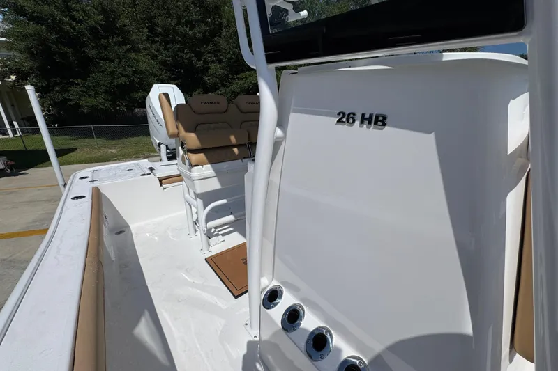 Slide: The Image of 2027 Caymas 26 HB boat interior with seating and console, showcasing sleek design and functionality. - 27