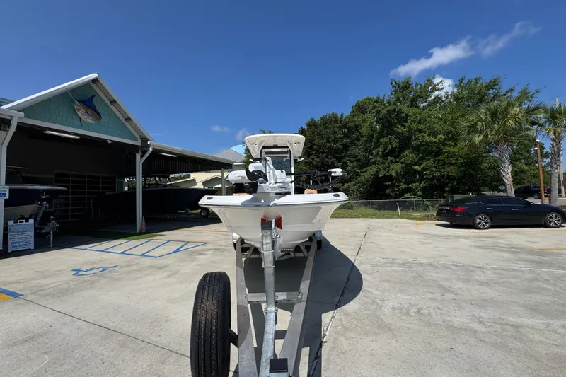 Slide: The Image of 2027 Caymas 26 HB boat on trailer in sunny outdoor setting. - 6