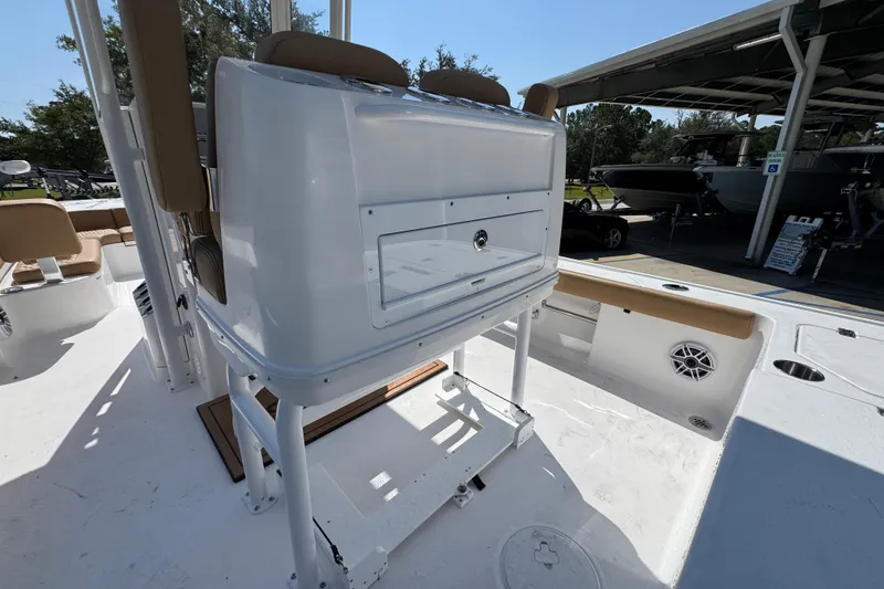 Slide: The Image of 2027 Caymas 26 HB boat interior with seating and storage compartments. - 37
