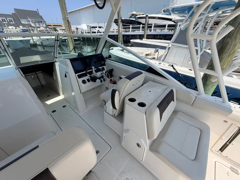 Slide: The Image of The image shows the cockpit of a 2022 Sailfish 276 DC with modern seating and controls. - 17