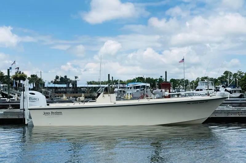 The Image of Jones Brothers Cape Fisherman 1910 boat docked at marina, clear sky, 2000 model. - 1