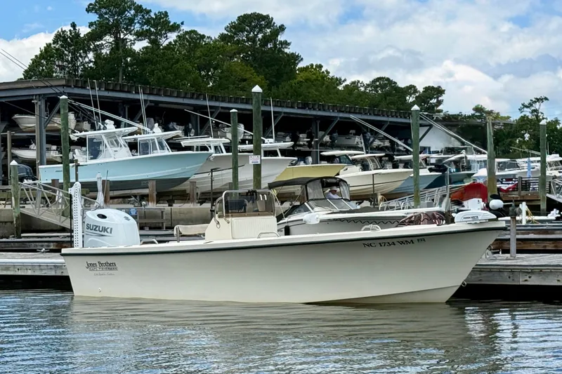 Slide: The Image of Jones Brothers Cape Fisherman 1910 boat docked at marina, 2000 model, with Suzuki engine. - 2