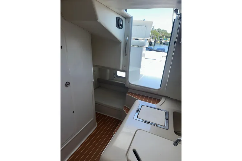 Slide: The Image of Interior view of 1994 Pro-Line 2950 Walkaround boat cabin with seating and hatch. - 8