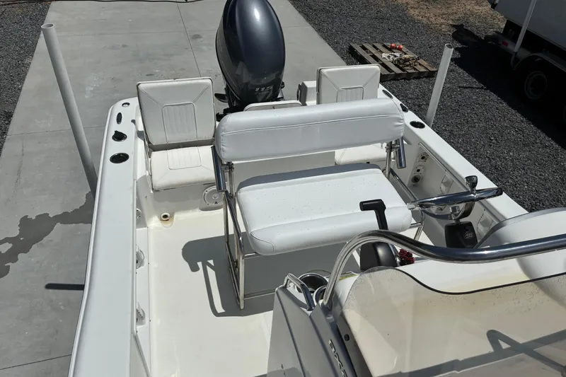 Slide: The Image of 2014 Sea Hunt BX 20 BR boat interior with seating and steering console. - 8