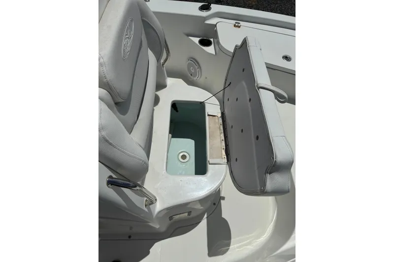 Slide: The Image of 2014 Sea Hunt BX 20 BR boat seat with storage compartment open. - 6