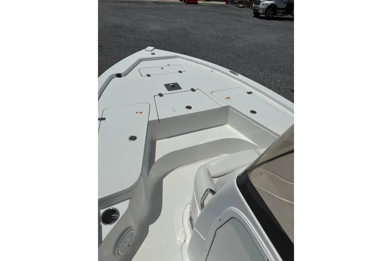 Slide: The Image of 2014 Sea Hunt BX 20 BR boat deck with storage compartments and seating. - 18